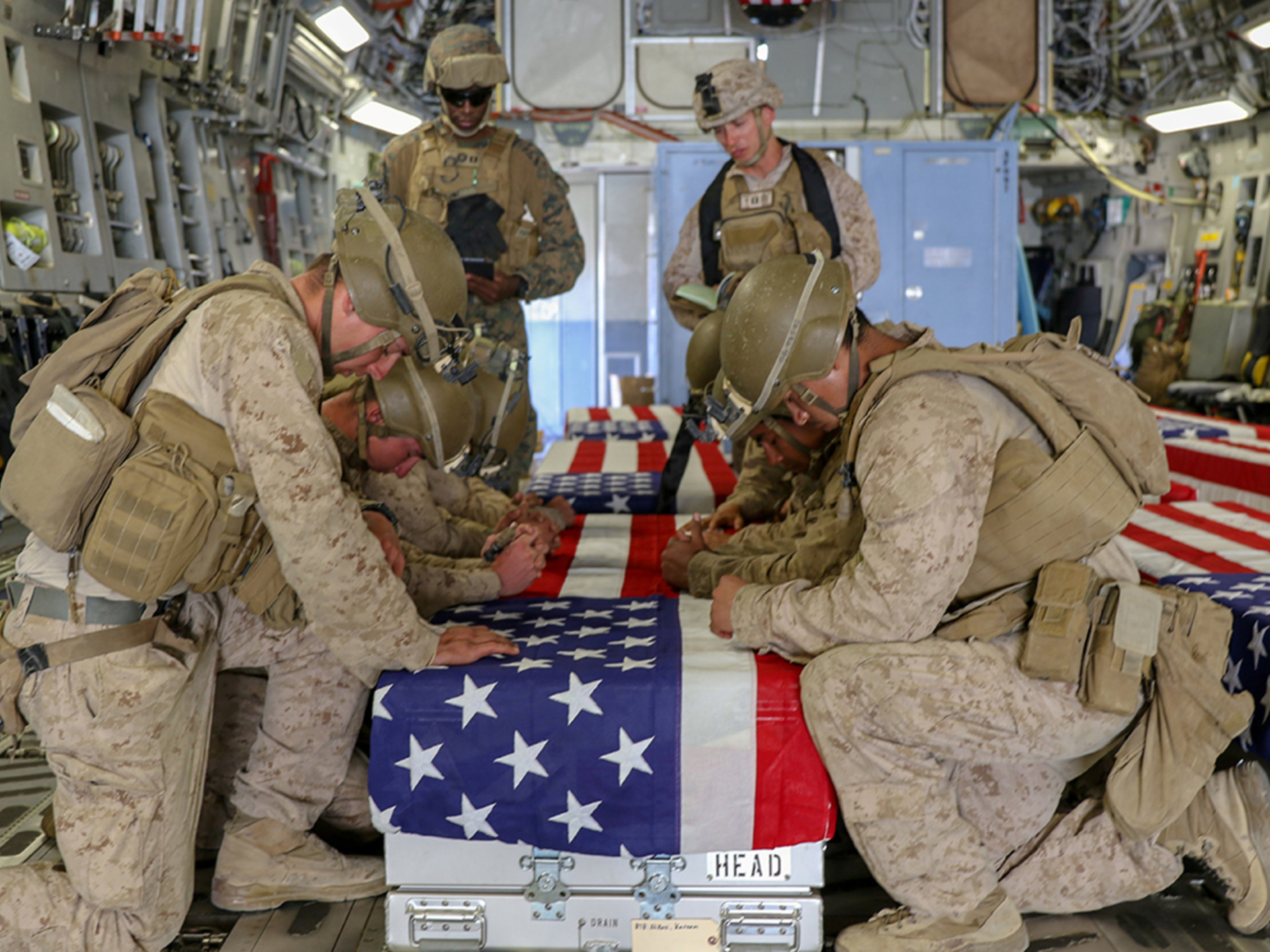 U.S. marines honor the service members killed outside of Hamid Karzai International Airport. 
