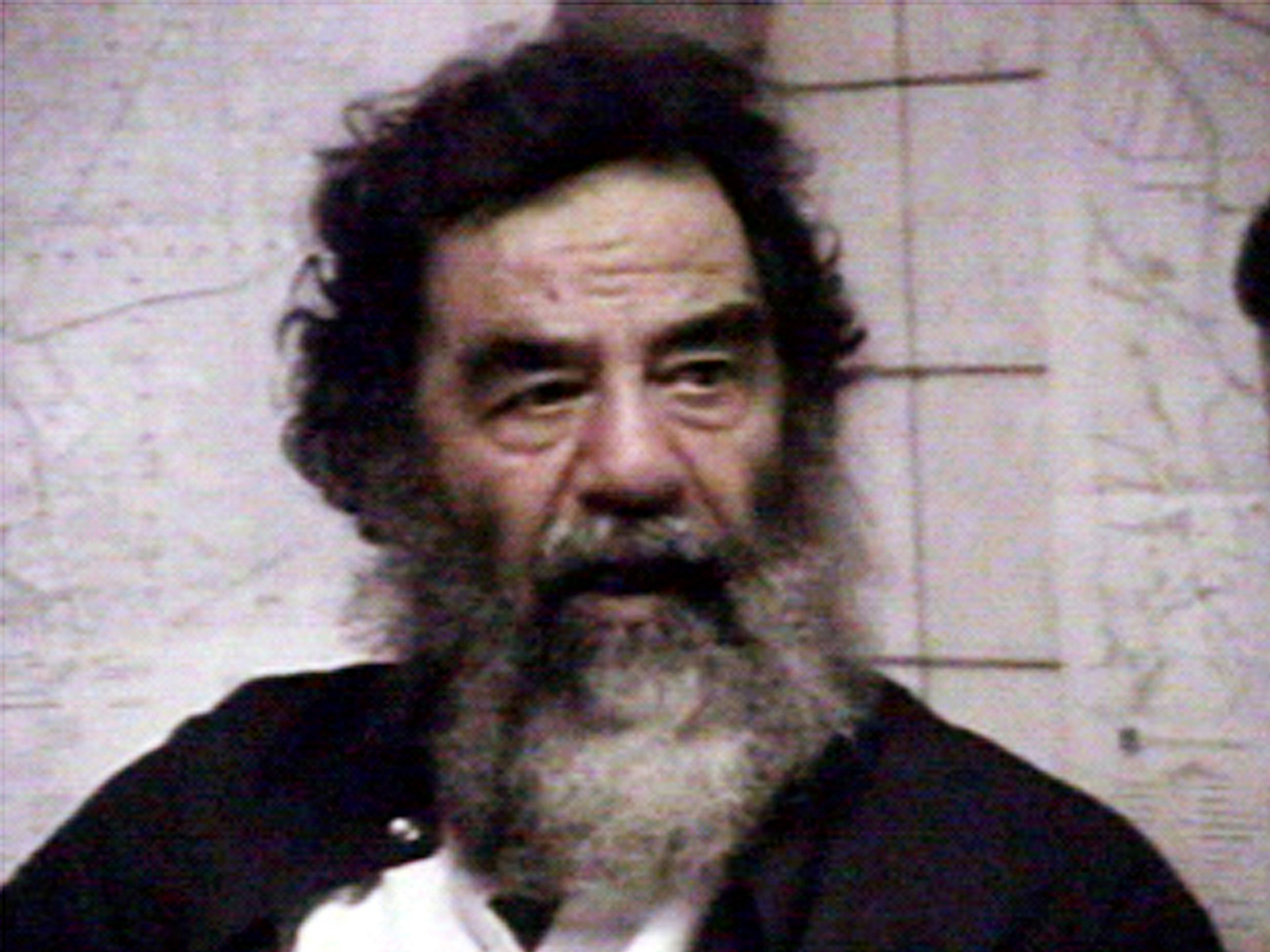 Saddam is filmed after his capture.