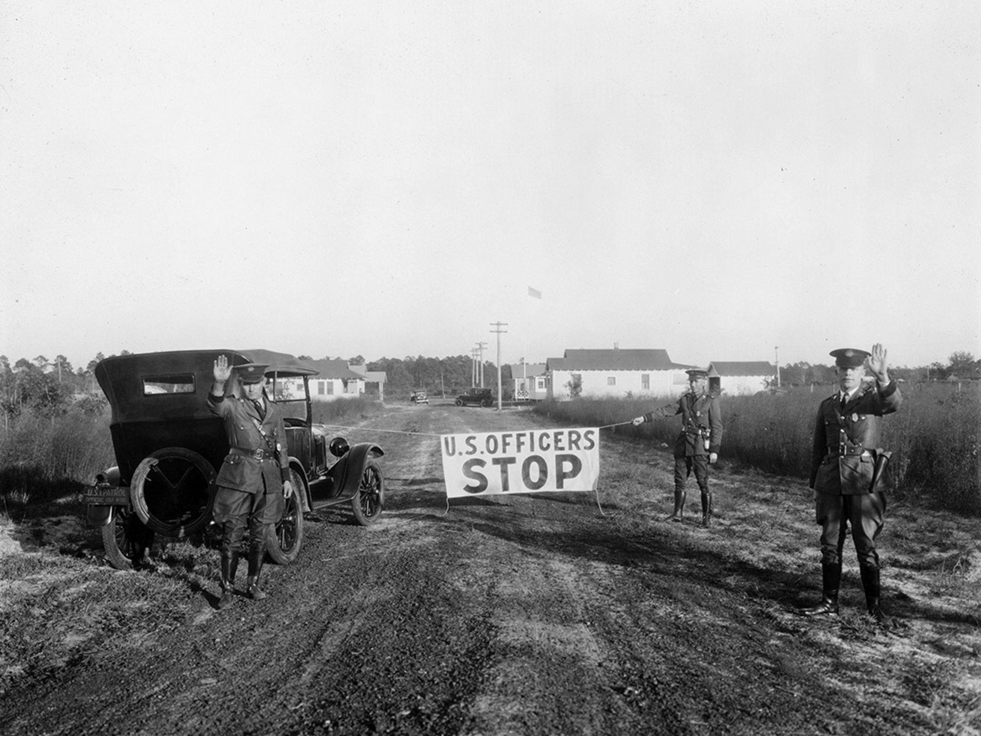 U.S. Border Patrol agents block a road in Gainesville, Florida, in 1926. National Archives