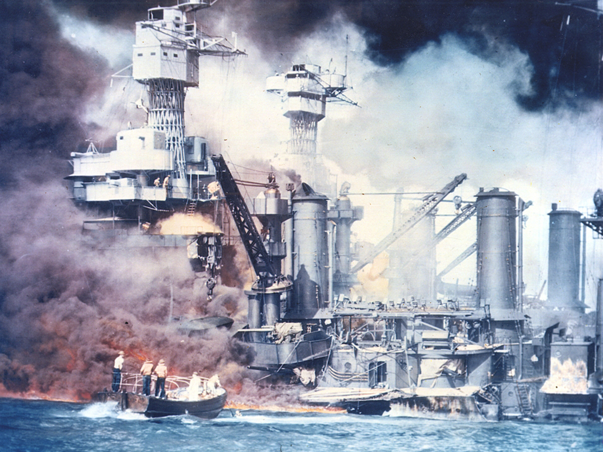 U.S. warships burn following the Japanese surprise attack on Pearl Harbor, Hawaii, on December 7, 1941.